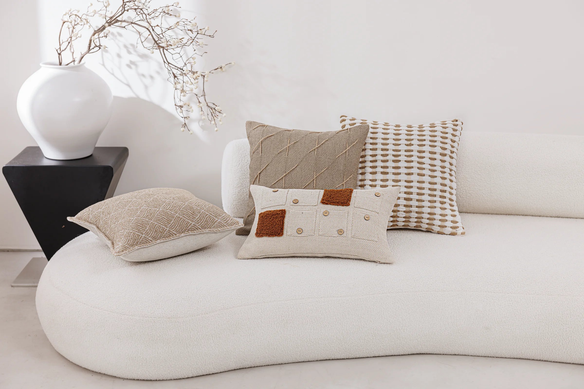 Atelier Ecru — four cushions in a living space
