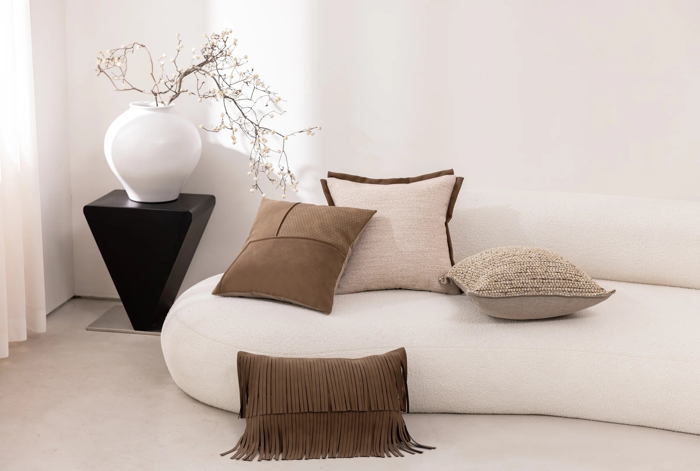 Cacao Fringe — four cushions in a living space