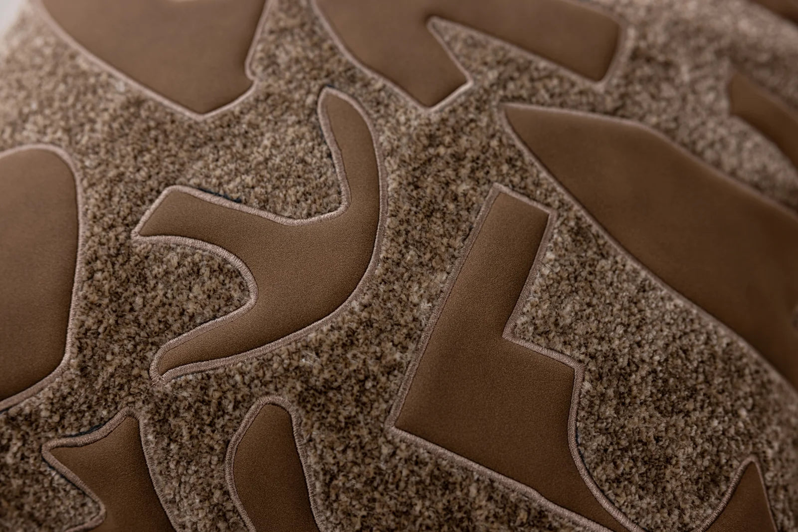 Bronze Relief — raised organic lines and textured surface